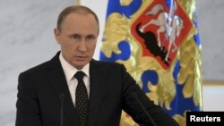 FILE - Russian President Vladimir Putin addresses the Federal Assembly at the Kremlin in Moscow.