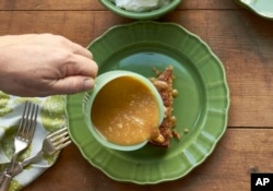 FILE - This October 2016 photo shows salted caramel sauce in New York. (Katie Workman via AP)