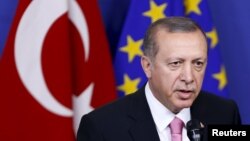 FILE - Turkish President Tayyip Erdogan's government faces increasing criticism for insisting that President Bashar al-Assad's immediate removal is the only way to end the conflict in Syria. 