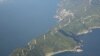 Wind turbines stand along the 50-kilometer (31-mile)-long Sadamisaki Peninsula in Ehime Prefecture, western Japan, which will now become more important as Japan shuts down its last operating nuclear power reactor, December 2, 2011 (file photo).