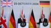 Menteri Pertahanan Inggris John Healey (kiri) dan Menteri Pertahanan Jerman Boris Pistorius (kanan) dalam konferensi pers setelah menandatangani Perjanjian Trinity House, di London, 23 Oktober 2024. (JUSTIN TALLIS / AFP)