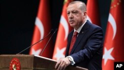Turkey's President Recep Tayyip Erdogan announces early presidential and parliamentary elections for June 24, 2018, at the Presidential Palace, in Ankara, Turkey, April 18, 2018. 