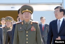 FILE - Choe Ryong Hae, center, director of the General Political Bureau of the Korean People's Army (KPA) of North Korea. Choe was absent from the state funeral for Ri Ul Sol.