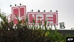 FILE - This photo shows a sign reading IRE (National Institute of Radioelements) in Fleurus, Belgium, Aug. 27, 2008. A security guard at the plant, identified as Didier Prospero, was killed Thursday, two days after terrorist attacks in Brussels.