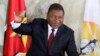 FILE - Mozambican President Felipe Nyusi poses at a polling station where he cast his vote in Maputo, Oct. 15, 2019. 