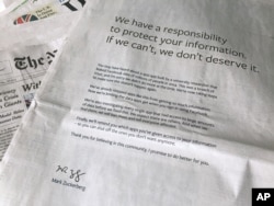 An advertisement in The New York Times is displayed on March 25, 2018, in New York. Facebook’s CEO has apologized for the Cambridge Analytica scandal with ads in multiple U.S. and British newspapers.