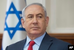 Israeli Prime Minister Benjamin Netanyahu attends the weekly cabinet meeting at his office in Jerusalem, Oct. 1, 2017.