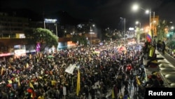 People take part in a protest against sexual assault by the police and the excess use of force against peaceful protests, in Bogota, Colombia, May 15, 2021.