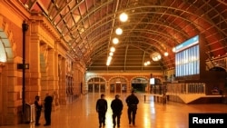 Police officers patrol the quiet Central Station in the city center during a lockdown to curb the spread of a coronavirus disease (COVID-19) outbreak in Sydney, Australia, Aug. 12, 2021.