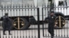 FILE - Police officers guard a court building in Rostov-on-Don, Russia, Sept. 15, 2015. 