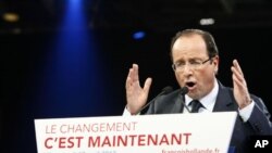 French Socialist Party candidate for the 2012 presidential elections Francois Hollande delivers his speech during a campaign meeting in Lille, northern France, April 17, 2012.
