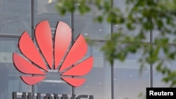 FILE - Signage is seen at Huawei offices in Reading, Britain, May 2, 2019. 