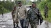 Congolese M23 rebel soldiers are seen on the road to Rushura, some 25 kilometers north of Goma, Nov. 22, 2012. 