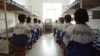 Falun Gong practitioners watch a video about a solar eclipse, part of deprogramming efforts enforced at the Masanjia Reeducation-through-labor camp in northeast China's Liaoning province. (file photo)