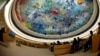FILE - Wu Hailong, special envoy of China's Foreign Ministry (L), addresses the Human Rights Council Universal Periodic Review session at the European headquarters of the United Nations in Geneva, Oct. 22, 2013. 