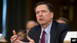 FILE - Then-FBI Director James Comey testifies before the Senate Intelligence Committee, on Capitol Hill in Washington, Jan. 10, 2017.