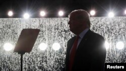 U.S. President Donald Trump is silhouetted at the "Salute to America" event during Fourth of July Independence Day celebrations at the Lincoln Memorial in Washington, D.C., July 4, 2019. 