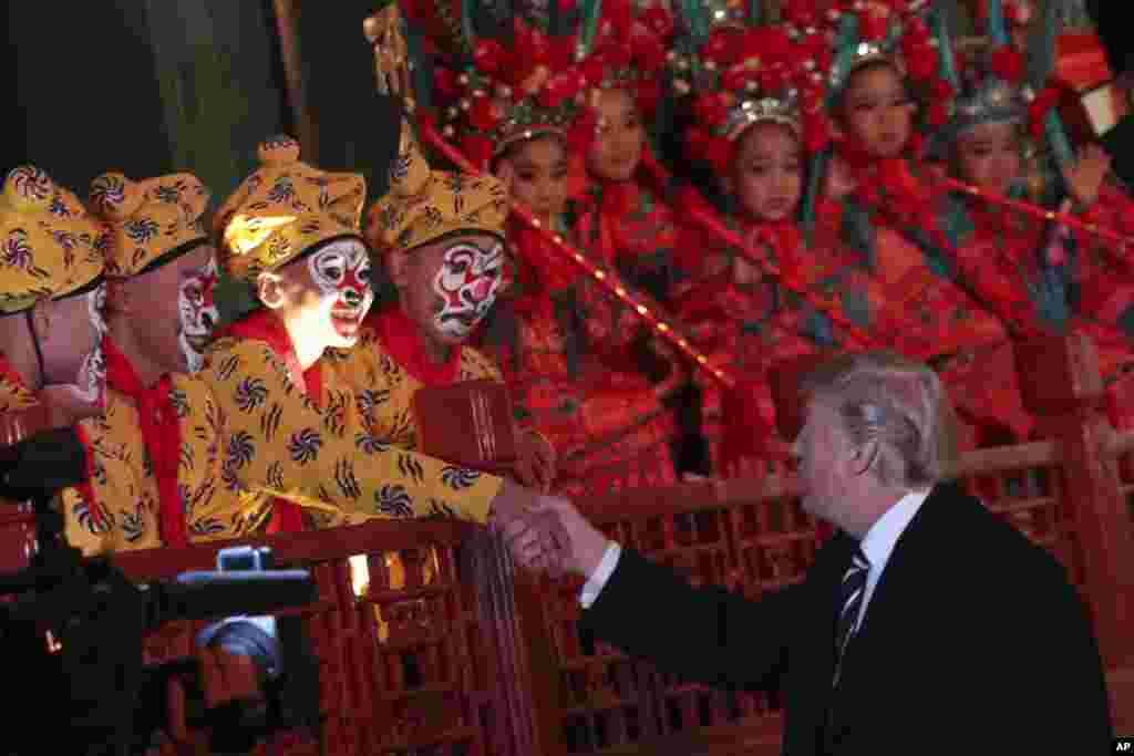 President Donald Trump meets opera performers at the Forbidden City in Beijing, China, Nov. 8, 2017.