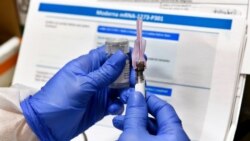 In this file photo, a nurse prepares a shot that is part of COVID-19 vaccine developed by the National Institutes of Health and Moderna Inc., in Binghamton, New York, July 27, 2020. (AP)