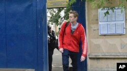 Russian opposition activist Alexei Navalny leaves a detention center in Moscow, Russia, June 14, 2018.