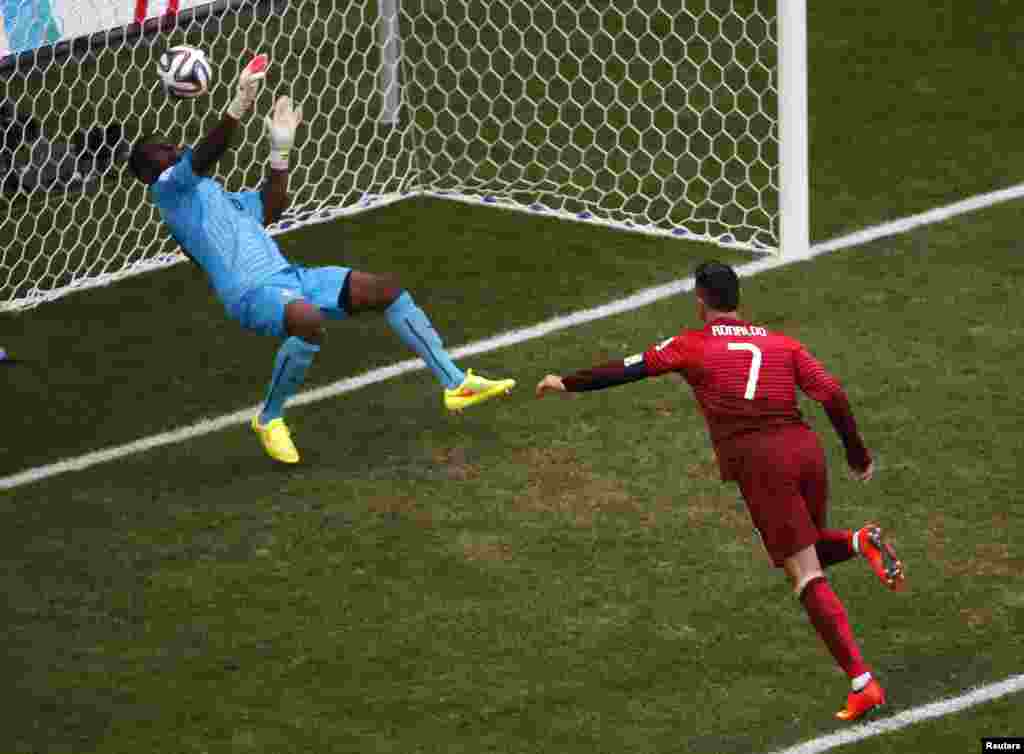 Ghana's goalkeeper Fatau Dauda denies Portugal's Cristiano Ronaldo with this tremendous save at the Brasilia national stadium in Brasilia, June 26, 2014.
