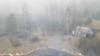 An aerial view shows grass and plants on fire, as an operation to extinguish wildfires around the defunct Chernobyl nuclear plant continues, in Lyudvynivka in Kyiv Region, Ukraine, April 18, 2020. 