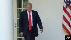 FILE - President Donald Trump walks out of the Oval Office into the Rose Garden of the White House in Washington, June 1, 2017. Republican lawmakers have begun to press Trump on whether tapes exist of his conversations with since fired FBI director James Comey.