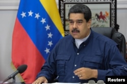 FILE - Venezuela's President Nicolas Maduro speaks during a Council of Ministers meeting at Miraflores Palace in Caracas, Venezuela, May 16, 2017.