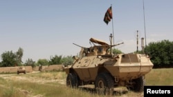 FILE - A military vehicle patrols in the Babaji area of Lashkar Gah Helmand province, Afghanistan, May 8, 2016. Afghan National Security and Defense Forces (ANDSF) entered Nawa district in southern Helmand province early Monday.
