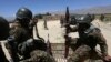 Afghan National Army soldiers patrol near polling stations in the outskirts of Kabul, June 12, 2014.