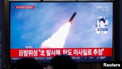 FILE - People in Seoul, South Korea, watch a TV broadcasting file footage for a news report on North Korea firing an unidentified projectile, Nov. 28, 2019.