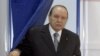 FILE - This May, 10, 2012, file photo shows Algerian President Abdelaziz Bouteflika exiting a parliamentary election voting booth in Algiers