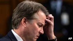 In this Sept. 6, 2018 photo, Supreme Court nominee, Brett Kavanaugh waits to testify before the Senate Judiciary Committee for the third day of his confirmation hearing, on Capitol Hill in Washington. 