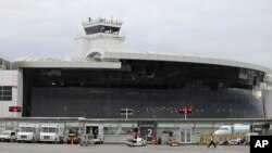 The central terminal Seattle-Tacoma International Airport is shown, Jan. 26, 2016, in Seattle. Former U.S. intelligence officer Ron Rockwell Hansen was arrested on June 3, 2018, while preparing to board a connecting flight to China.