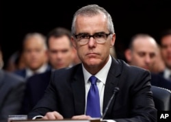 FILE - Acting FBI Director Andrew McCabe appears before a Senate Intelligence Committee hearing about the Foreign Intelligence Surveillance Act, on Capitol Hill in Washington, June 7, 2017. McCabe has been buffeted by attacks from President Donald Trump