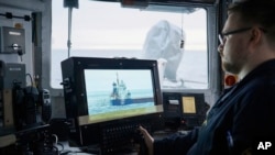 FILE - An Estonian naval ship sails in the Baltic Sea on Jan. 9, 2025, as part of stepped-up NATO patrols in the region following suspected sabotage of undersea cables. 