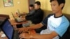 Cambodian men are using internet at a coffee shop in Phnom Penh, file photo. 