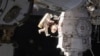 Russian Cosmonauts Take Spacewalk to Check Site of Capsule Leak