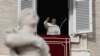 Pope Francis waves to faithful during the Angelus noon prayer in St. Peter's Square, at the Vatican, Sunday, Dec. 16, 2018.