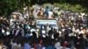 Sudanese protesters hold a sit-in outside the presidential palace in Khartoum, demanding a return to military rule, on October 21, 2021.