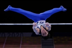 Kohei Uchimura, of Japan, competes on the horizontal bar during the men's artistic gymnastic qualifications at the 2020 Summer Olympics, July 24, 2021, in Tokyo, Japan.