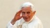 Pope Benedict XVI waves as he arrives to lead the Wednesday general audience in Saint Peter's square, at the Vatican October 24, 2012. 