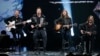 FILE - Imagine Dragons performs during the taping of "The Night That Changed America: A Grammy Salute To The Beatles", which commemorates the 50th anniversary of The Beatles appearance on the Ed Sullivan Show, in Los Angeles January 27, 2014. 