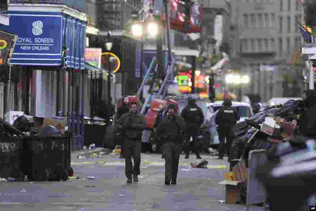 Emergency services attend the scene after a vehicle drove into a crowd on New Orleans' Canal and Bourbon Street, Jan. 1, 2025. 