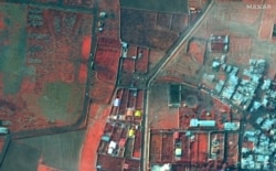 A color-infrared view shows the area where an Ukraine International Airlines plane crashed after takeoff from Iran's Imam Khomeini airport, on the outskirts of Tehran, Maxar's WorldView-2 satellite image taken Jan. 9, 2020.