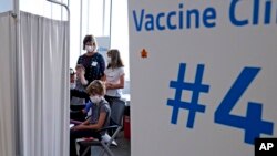 FILE - Graham Roark, 8, receives the Pfizer COVID-19 vaccine at Lurie Children's hospital in Chicago, Nov. 5, 2021.