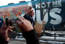Democratic presidential candidate Sen. Bernie Sanders, I-Vt., waves as he leaves after speaking at a Super Bowl watch party campaign event, Sunday, Feb. 2, 2020, in Des Moines, Iowa.