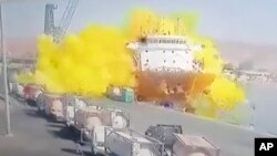 This photo taken from CCTV video broadcast by Al-Mamlaka TV shows the explosion of a chlorine gas container in the port of Aqaba, Jordan, June 27, 2022.