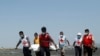 Members of the Myanmar Red Cross carry the body of the driver of a United Nations-marked vehicle after it came under attack while delivering test samples for coronavirus, in Sittwe, Rakhine state, April 21, 2020. 