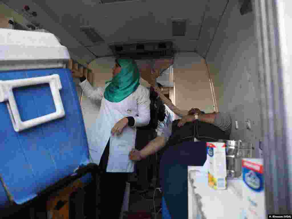 An Egyptian man donates blood after the blast in front of the Cathedral complex in Abassya, Cairo, Dec. 11, 2016.